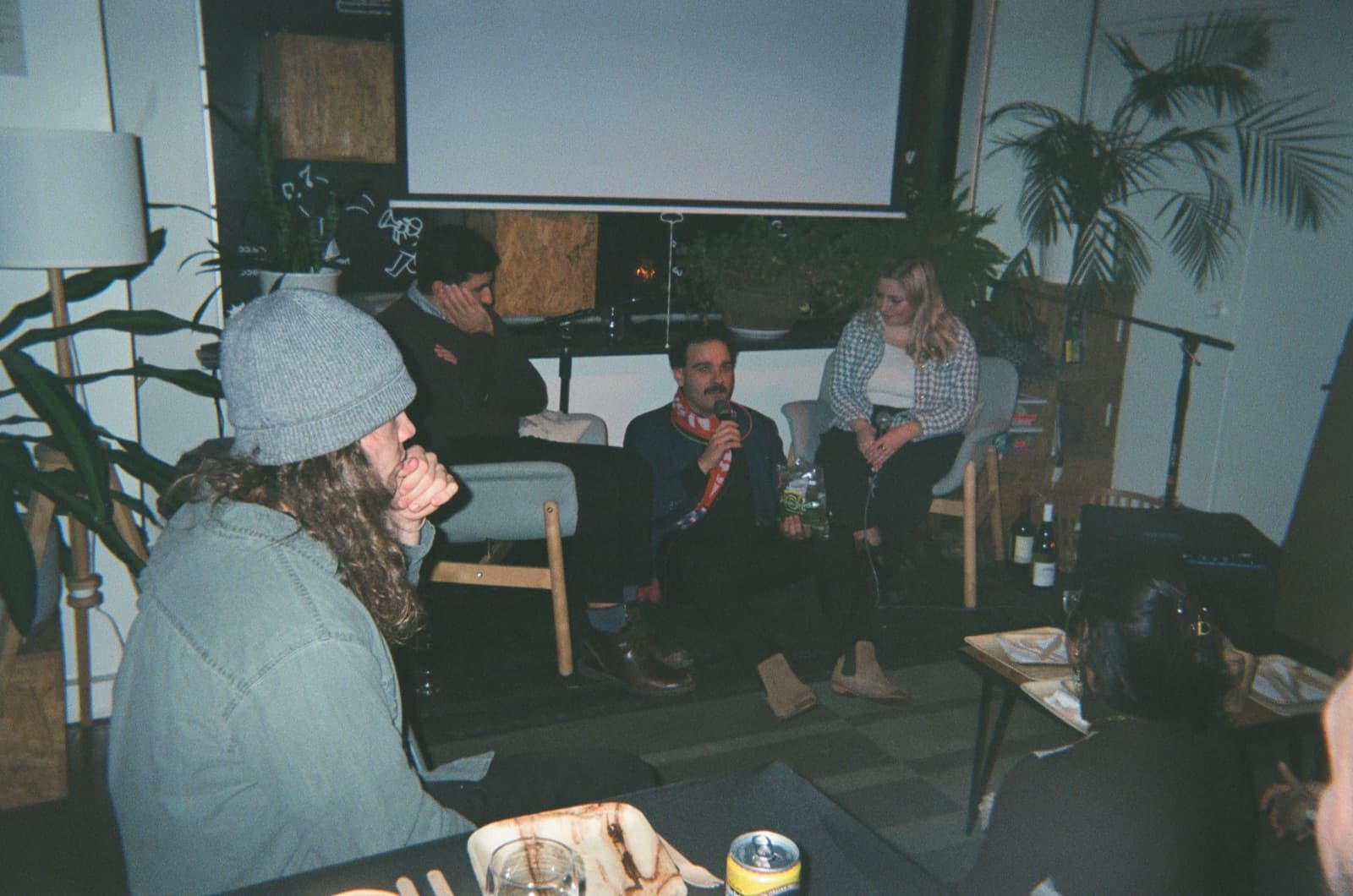 A speaker mid-thought; the room listening.